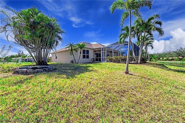 view of yard with a lanai