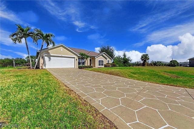 single story home featuring a garage and a front lawn