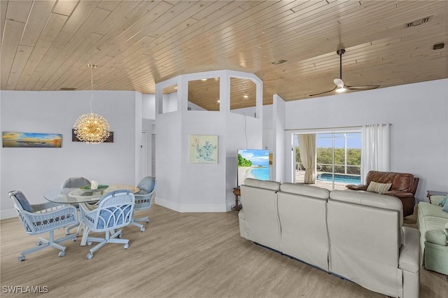 living room with light hardwood / wood-style flooring, wooden ceiling, ceiling fan, and vaulted ceiling