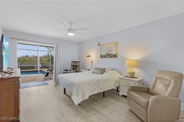 5139 Genesee Pkwy, Bokeelia, FL 33922 - bedroom featuring a sunroom, access to exterior, a ceiling fan, and light wood finished floors
