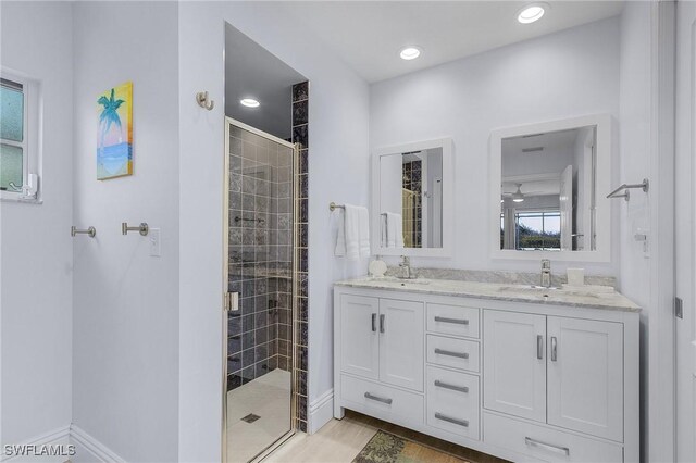 5139 Genesee Pkwy, Bokeelia, FL 33922 - bathroom featuring double vanity, a sink, and a stall shower
