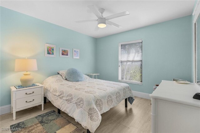 bedroom featuring ceiling fan and light hardwood / wood-style flooring