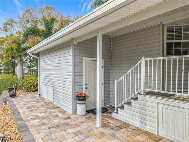 entrance to property featuring a patio area