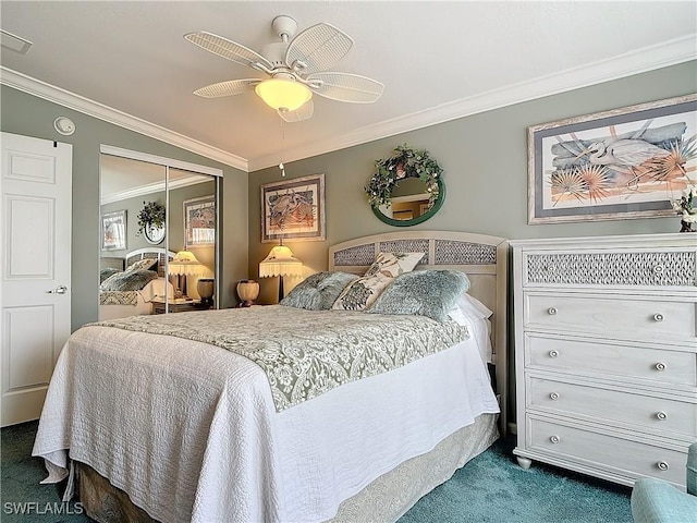 bedroom featuring vaulted ceiling, ornamental molding, a closet, ceiling fan, and carpet