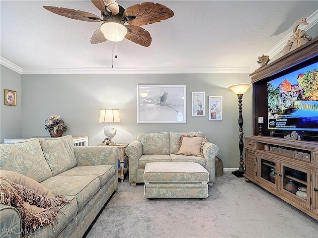 carpeted living room featuring crown molding and ceiling fan