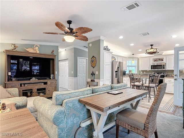 interior space featuring crown molding and ceiling fan