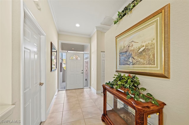 tiled entrance foyer with ornamental molding