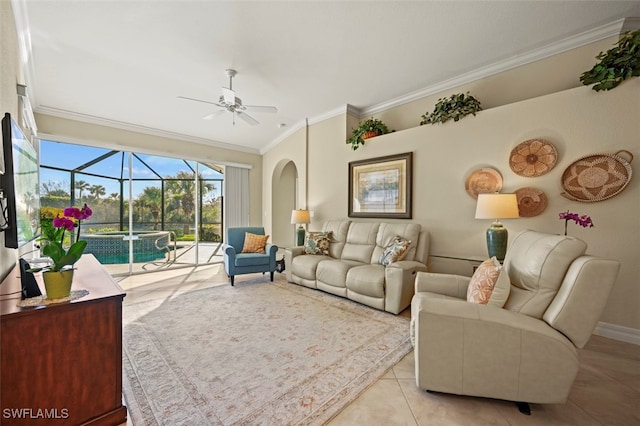 living room featuring ceiling fan, ornamental molding, and light tile patterned floors