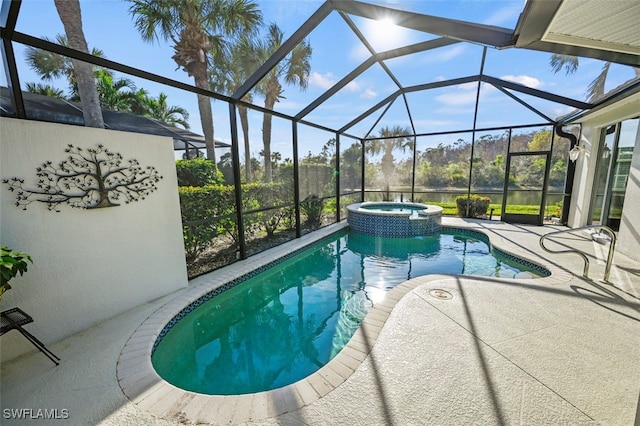 view of pool featuring an in ground hot tub, a lanai, and a patio area