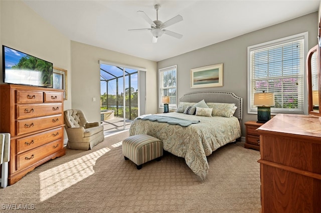 bedroom with light carpet, access to outside, and ceiling fan