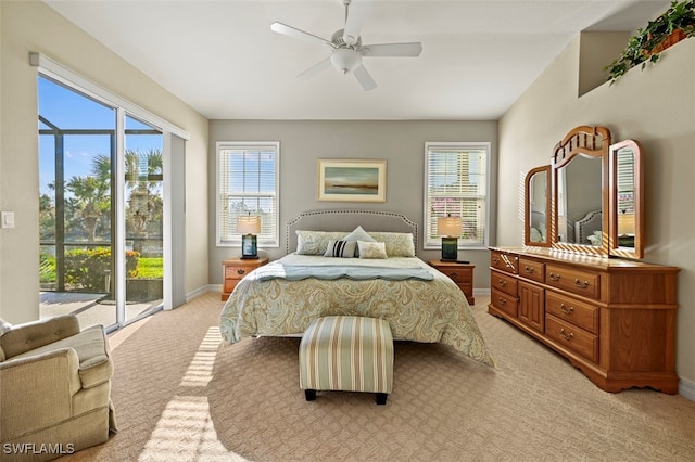 carpeted bedroom featuring ceiling fan and access to outside