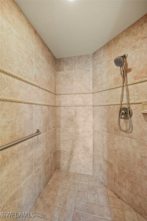 bathroom with tiled shower