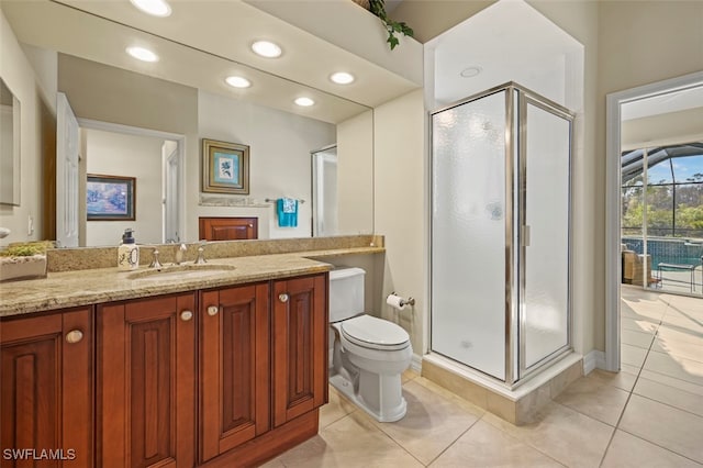 bathroom with vanity, tile patterned flooring, toilet, and walk in shower