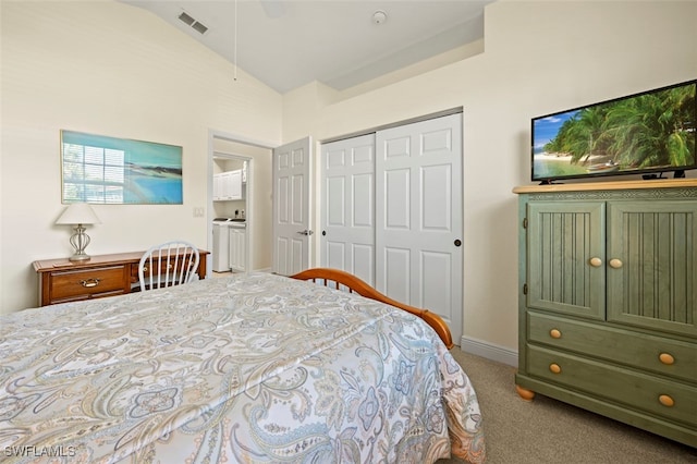 carpeted bedroom featuring lofted ceiling and a closet