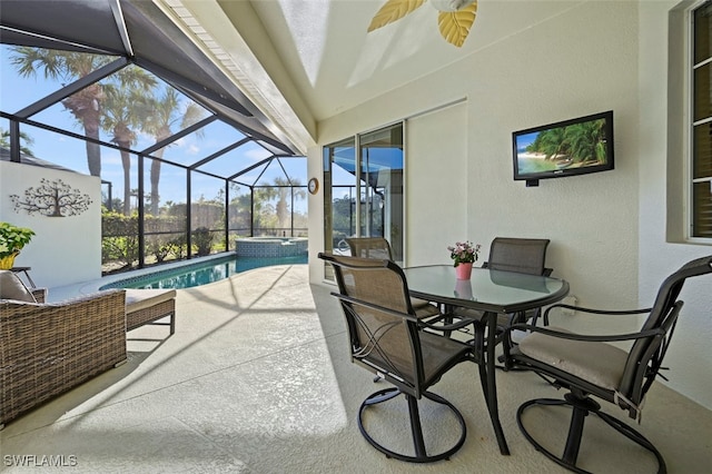 view of patio / terrace featuring a swimming pool with hot tub and a lanai