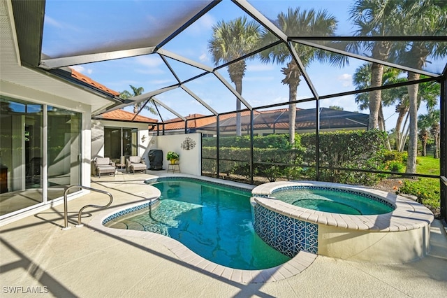 view of pool with a lanai, a patio, and an in ground hot tub