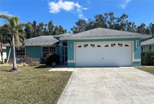 single story home featuring a garage and a front yard