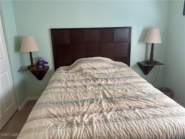 carpeted bedroom with baseboards