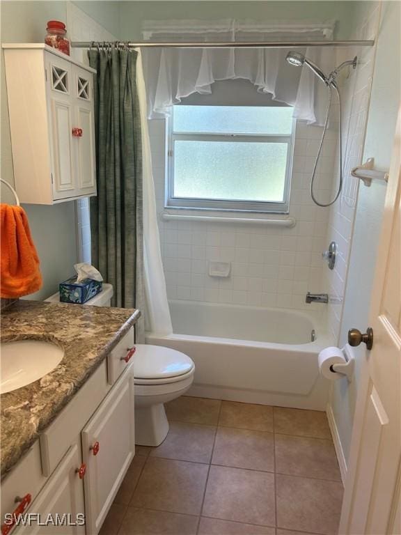 bathroom with tile patterned flooring, toilet, shower / tub combo, and vanity