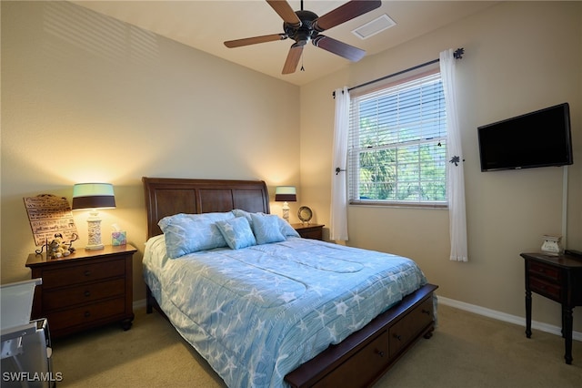 bedroom featuring ceiling fan and light colored carpet