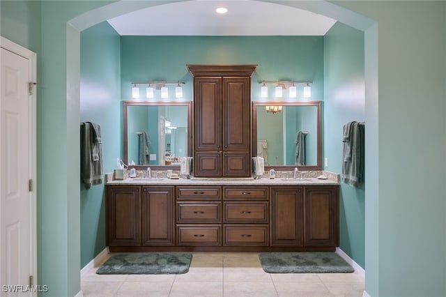 bathroom featuring tile patterned flooring and vanity