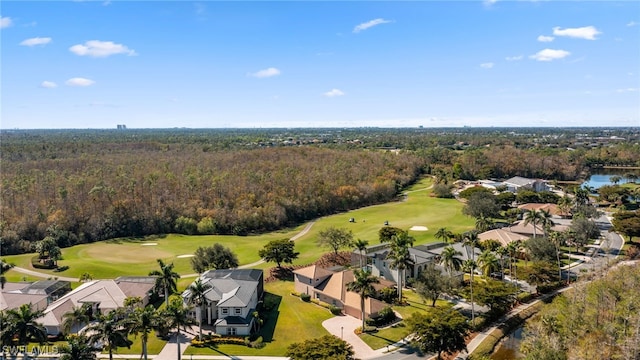 aerial view featuring view of golf course, a water view, and a view of trees