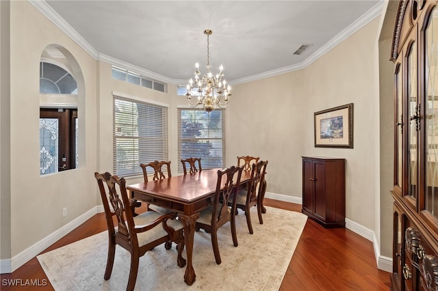 dining area with a chandelier, dark wood-style flooring, visible vents, and baseboards