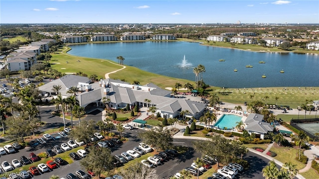 drone / aerial view featuring a water view and a residential view