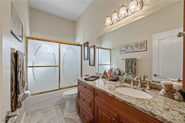 full bath featuring toilet, bath / shower combo with glass door, and vanity