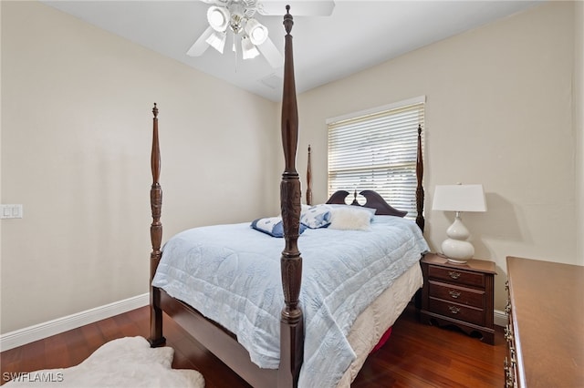 bedroom with a ceiling fan, baseboards, and dark wood-type flooring