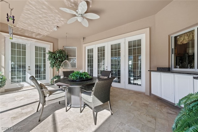 sunroom with ceiling fan and french doors