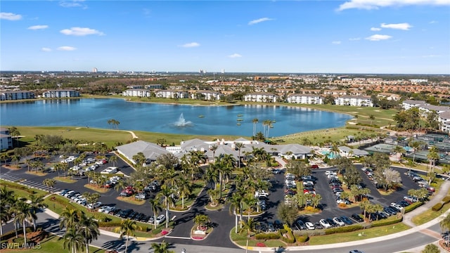 drone / aerial view featuring a water view and a residential view