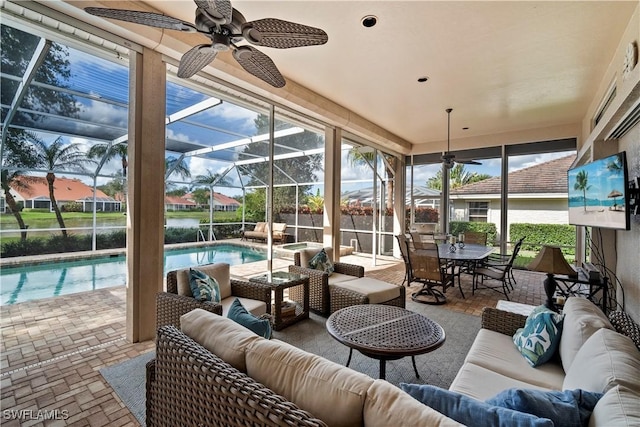 sunroom / solarium with ceiling fan