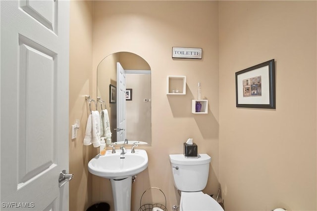 half bathroom with toilet