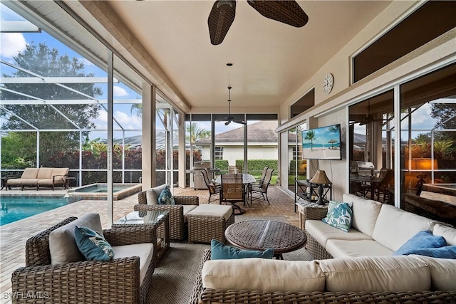 sunroom / solarium with a ceiling fan