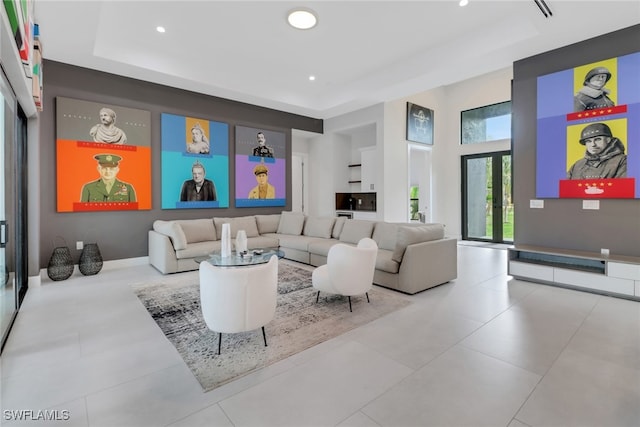 lobby with a raised ceiling and french doors