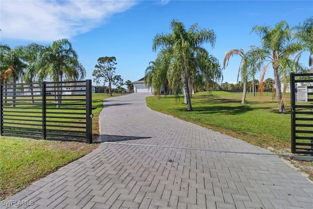 view of home's community featuring a yard