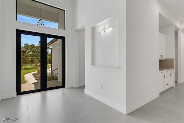 entryway with a high ceiling