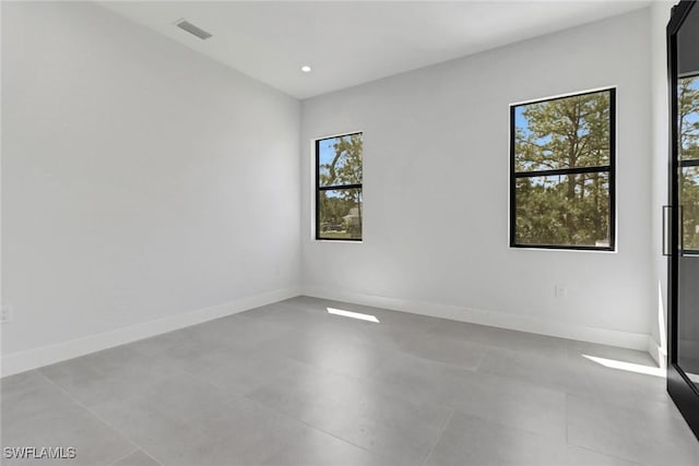 spare room with a wealth of natural light