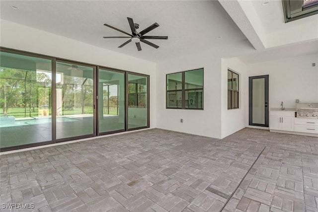 view of patio / terrace with area for grilling and ceiling fan