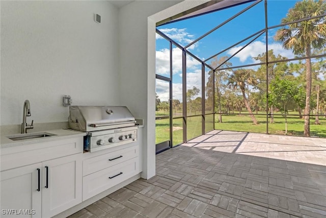 unfurnished sunroom with sink and plenty of natural light