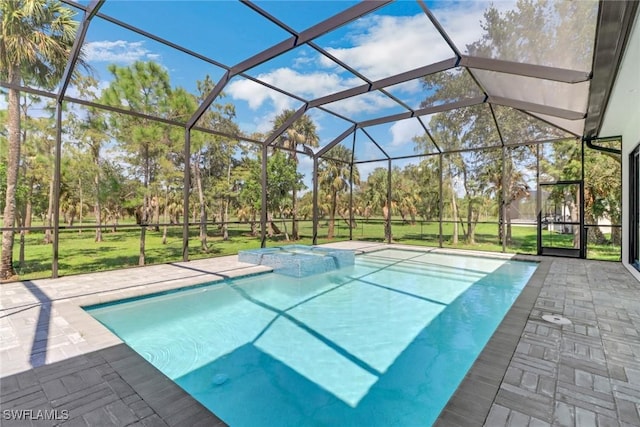 view of swimming pool with an in ground hot tub, glass enclosure, and a patio area