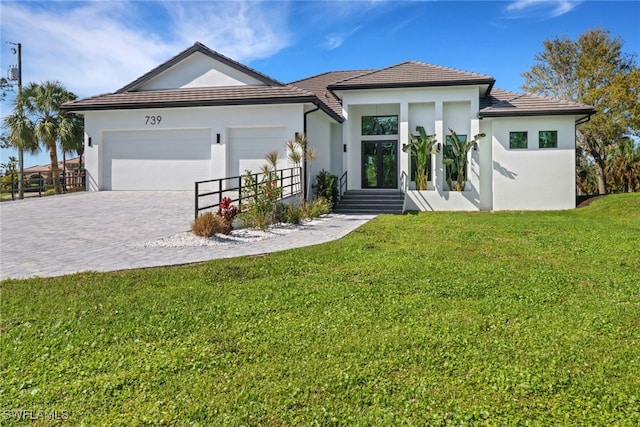 view of front facade with a garage and a front yard