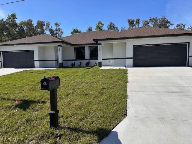 ranch-style house featuring a front lawn, an attached garage, and stucco siding