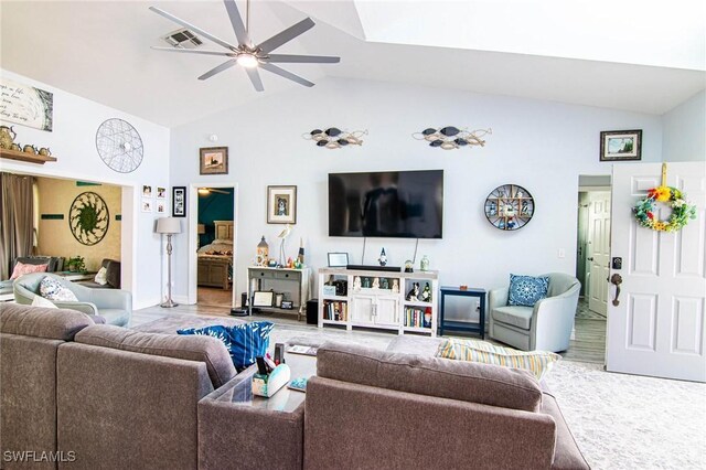 living room featuring vaulted ceiling and ceiling fan