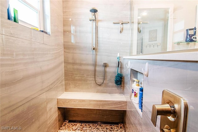 full bathroom with a tile shower