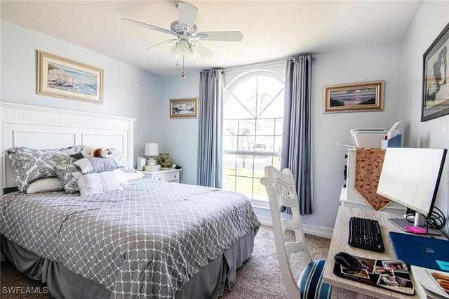 carpeted bedroom with ceiling fan