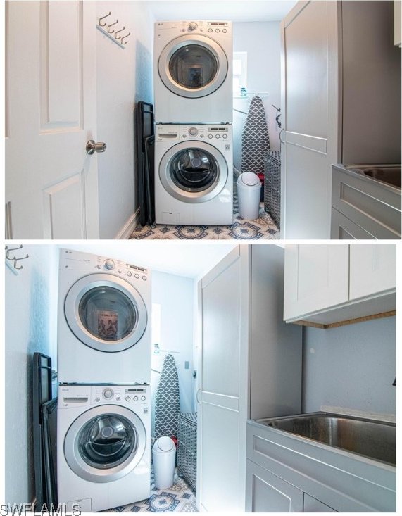 laundry room with cabinets and stacked washer / dryer