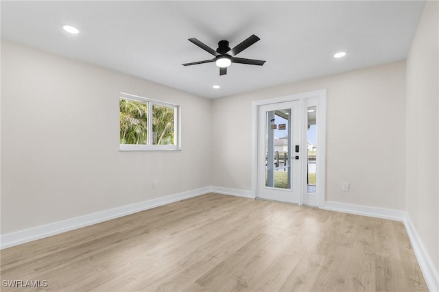 unfurnished room featuring ceiling fan and light hardwood / wood-style flooring