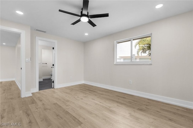 empty room with light wood-style flooring, baseboards, a ceiling fan, and recessed lighting